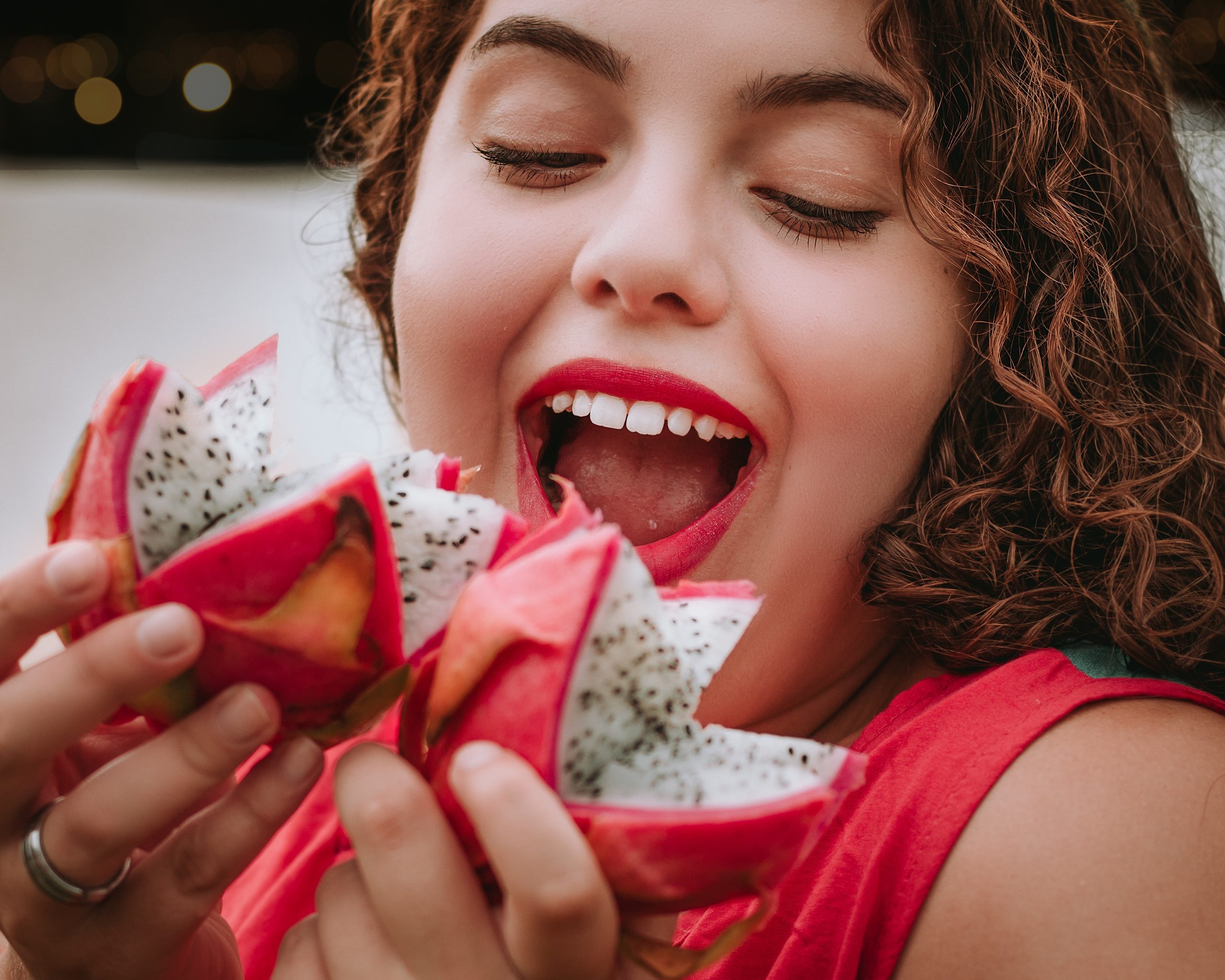 woman eating dragonfruit
